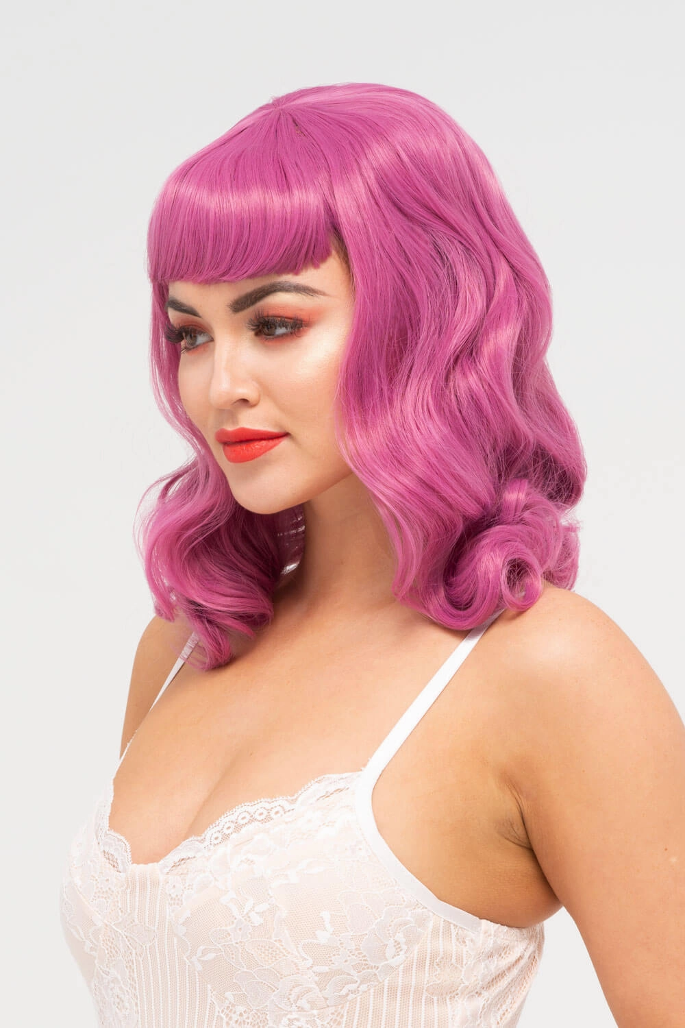 Pink pinup style wig, with finger waves and a short fringe, 1950s style: Stevie