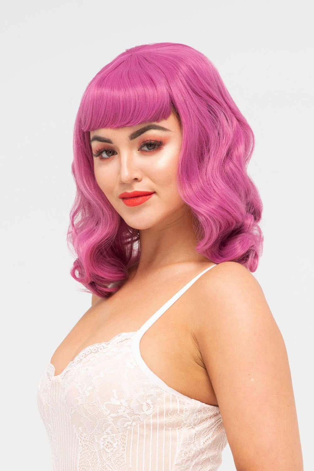 Pink pinup style wig, with finger waves and a short fringe, 1950s style: Stevie