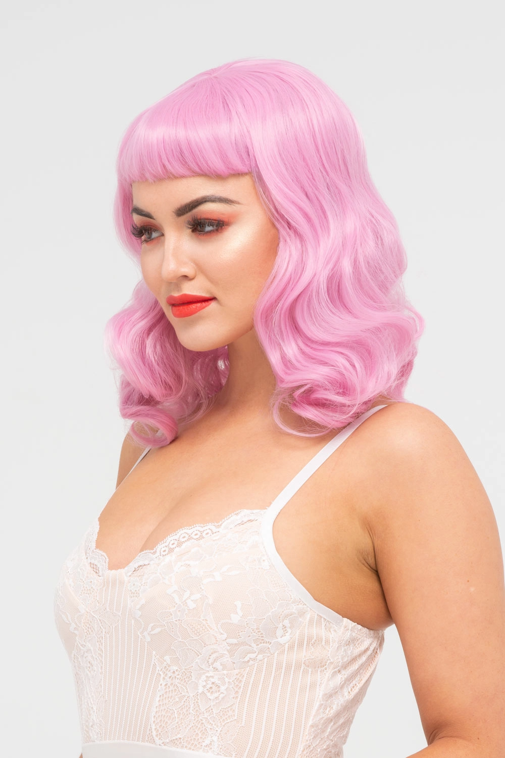 Pink pinup style wig, with finger waves and a short fringe, 1950s style: Stevie