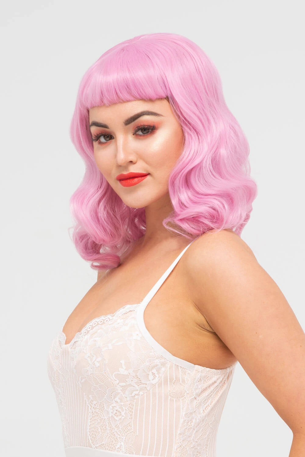 Pink pinup style wig, with finger waves and a short fringe, 1950s style: Stevie